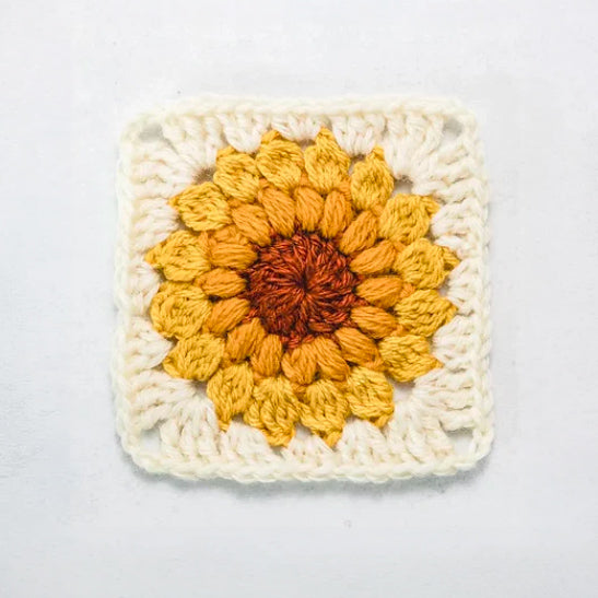 Sunburst granny square in cream and golden yellow